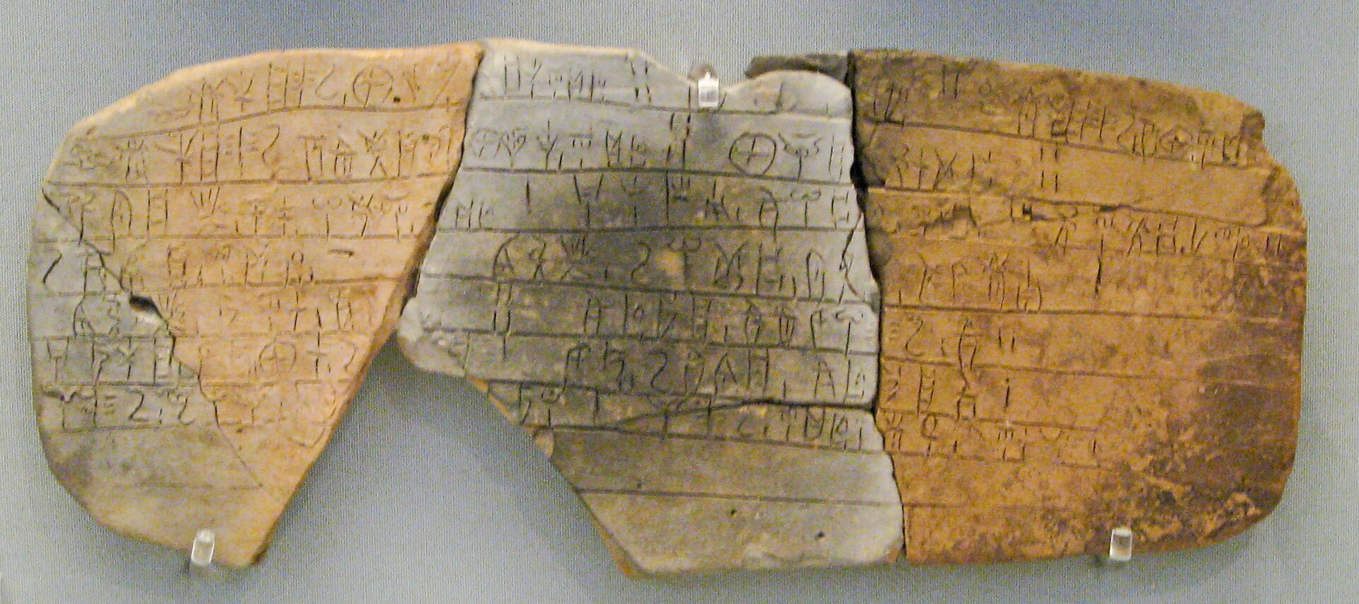 Small clay tablet inscribed with lines of Linear B script